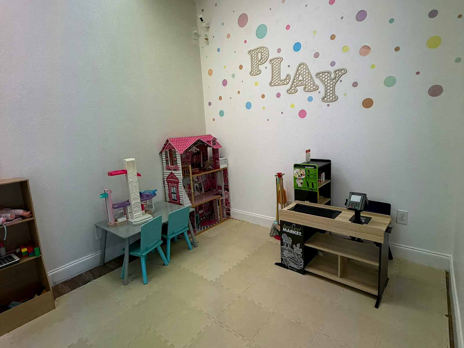 Kids Room play area with a red table and chairs at Gracie Barra Southlake